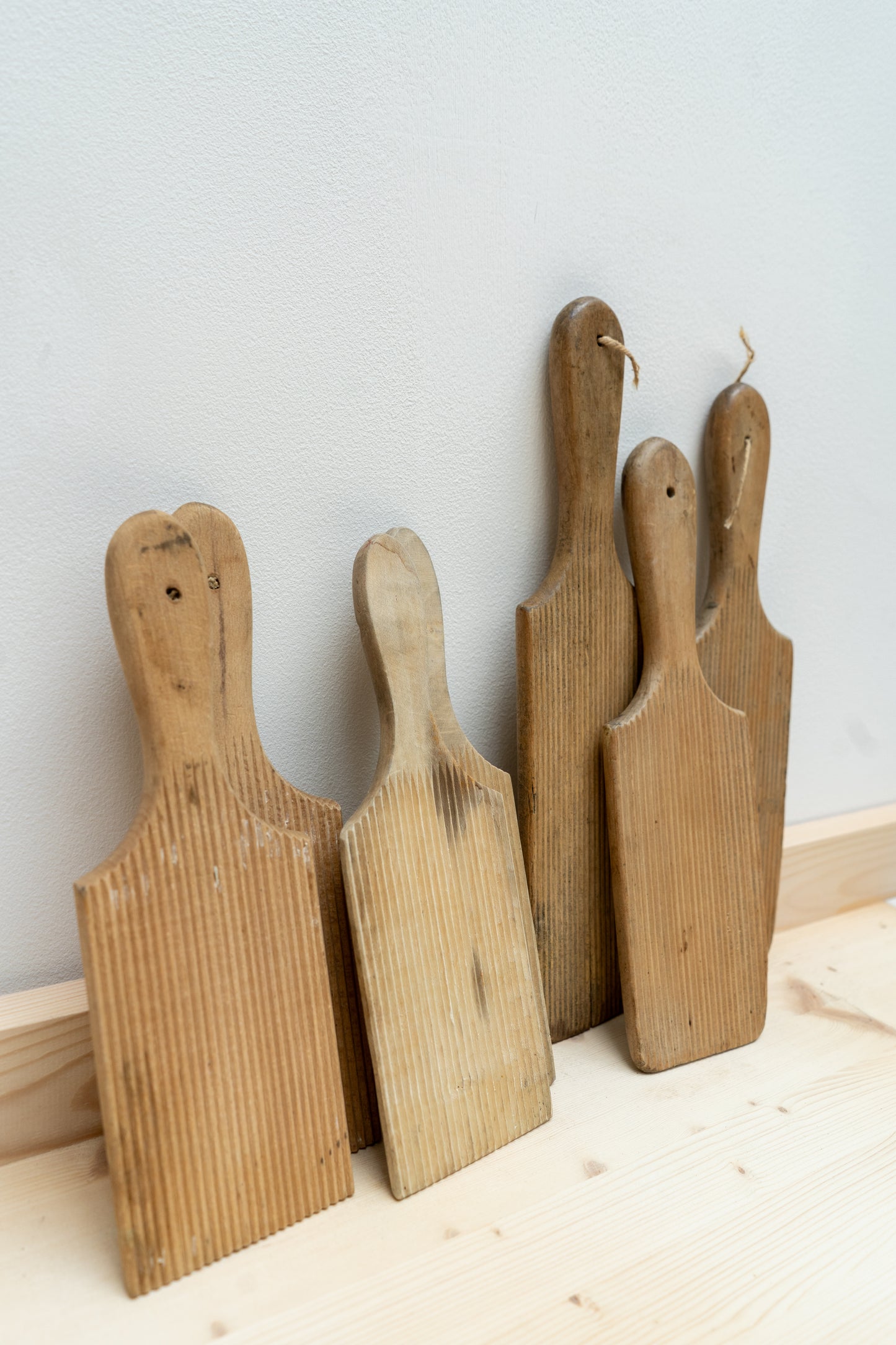 Set of wooden butter pats on a light surface with a neutral background