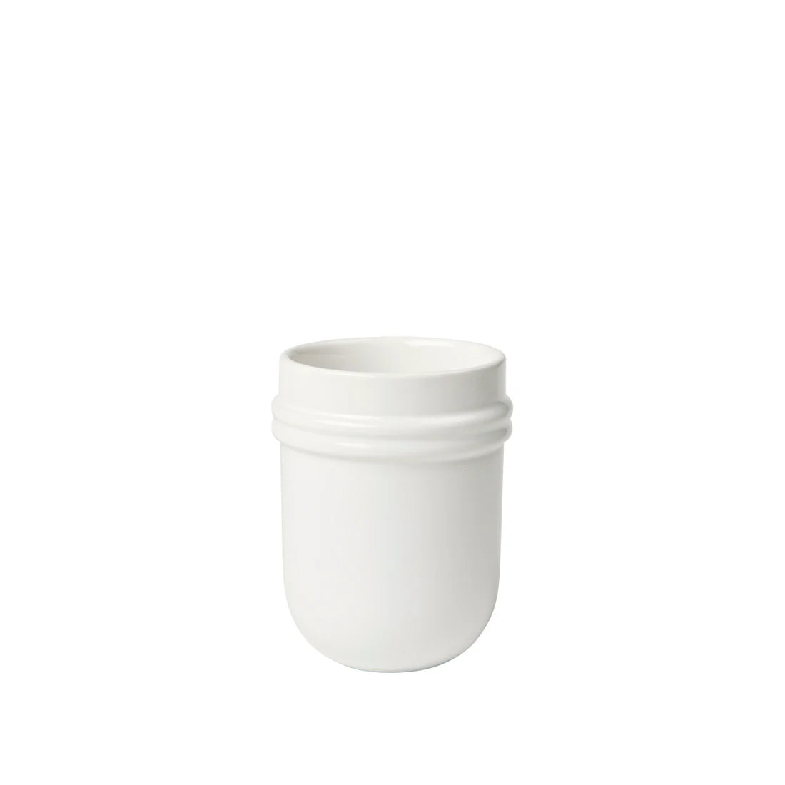 White ceramic tumbler on a white background