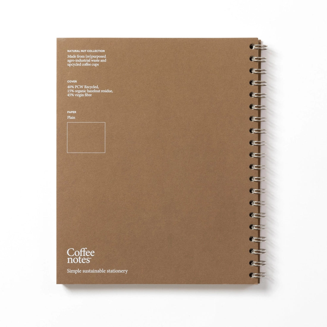 Sustainable notebook made from recycled coffee cups with visible branding on a white background