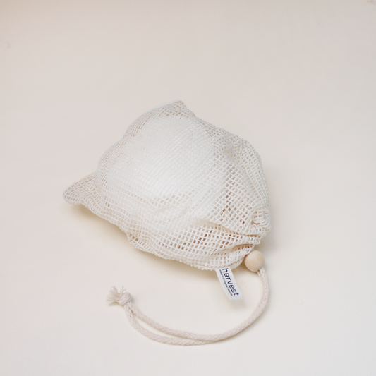 Harvest bamboo face pads in natural cotton mesh drawstring bag with wooden bead