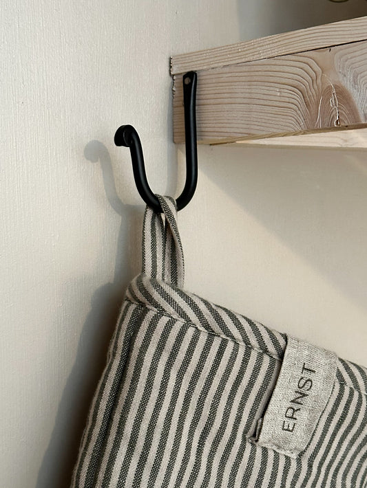 Strömshaga simple black iron hook 9cm mounted on wooden shelf with striped linen oven glove