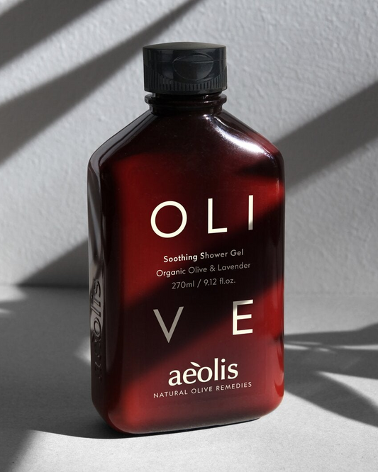 Aeolis olive and lavender shower gel in sunlight with leaf shadows
