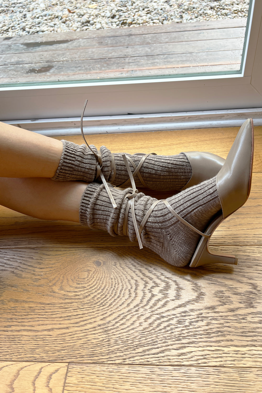 Le Bon Shoppe Cottage Socks in Flax styled with taupe lace-up heels on oak floor