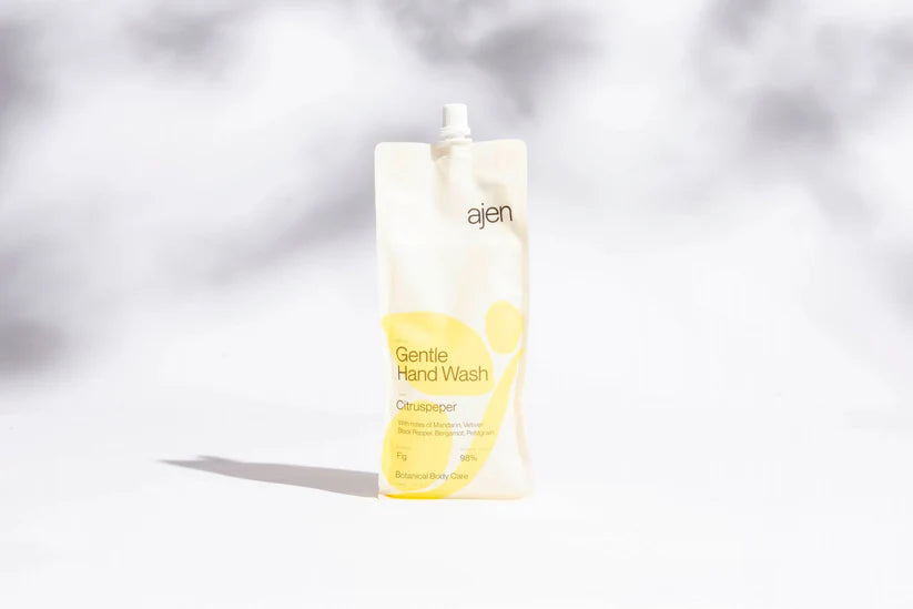 Ajen Gentle Hand Wash bottle on a light gray background.