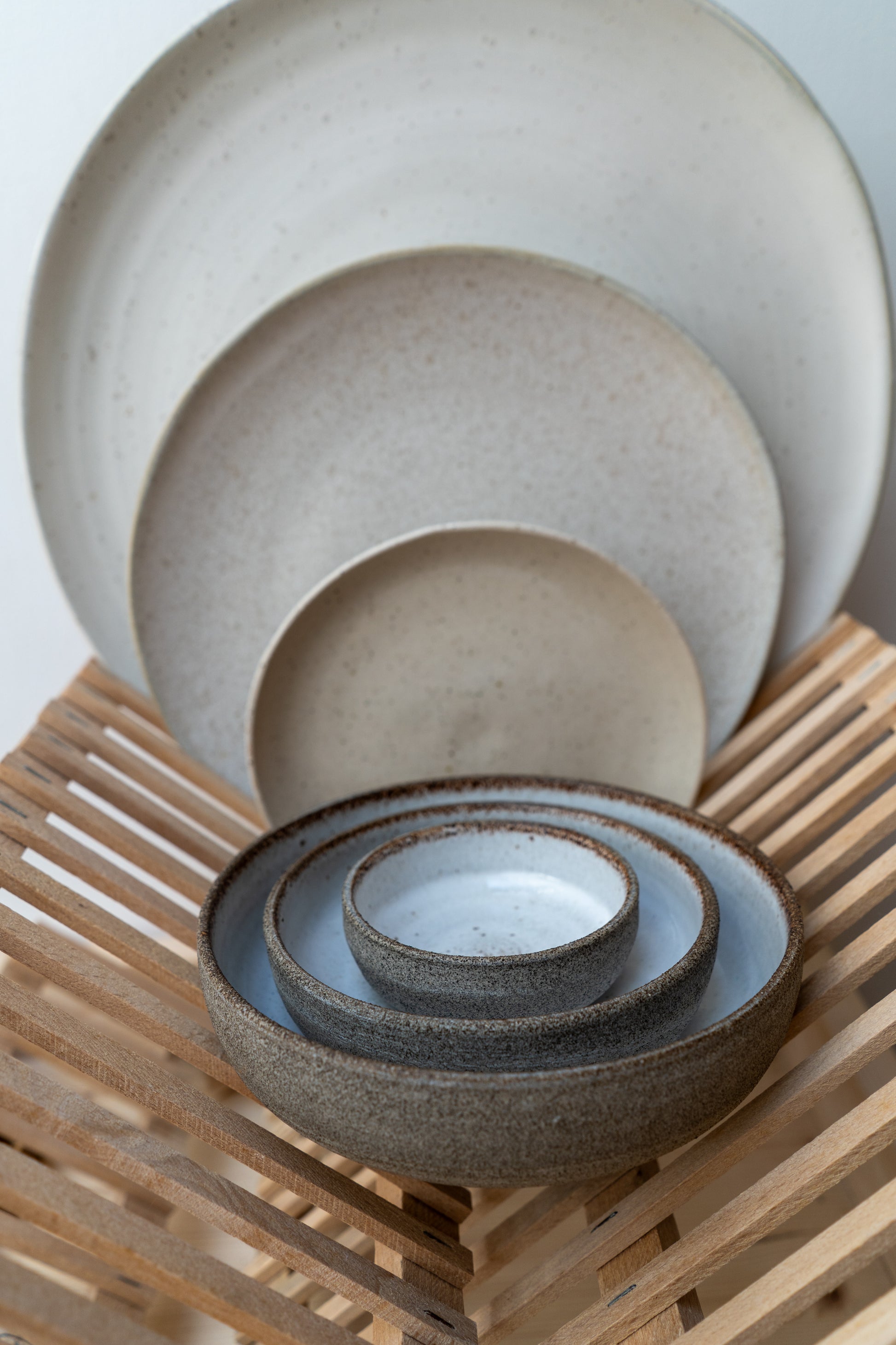 Set of ceramic bowls on a wooden surface