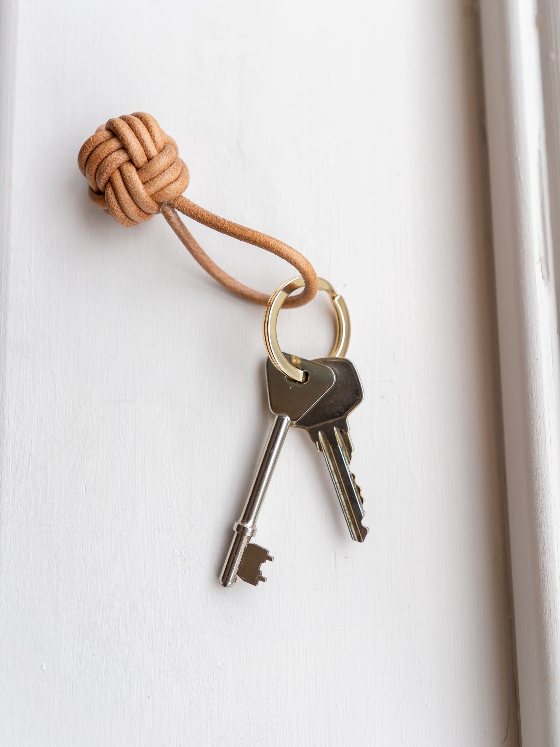 Keyring with keys on a white windowsill