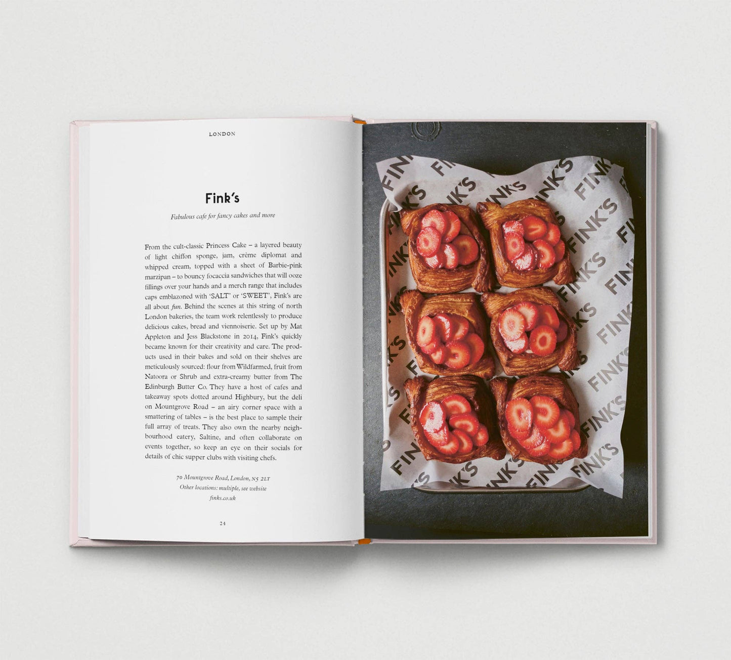 Open book showing a page with text and an image of food on a white background