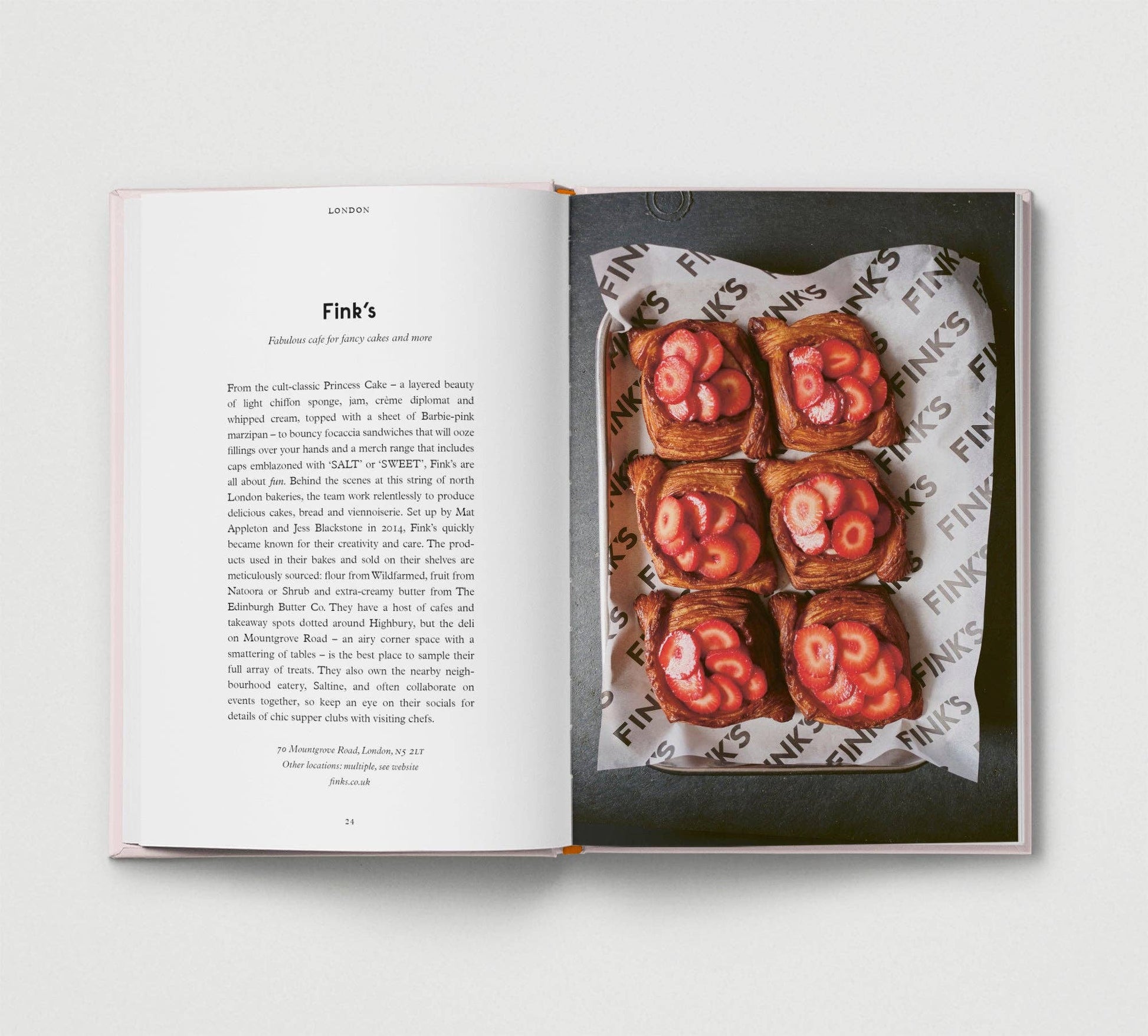 Open book showing a page with text and an image of food on a white background
