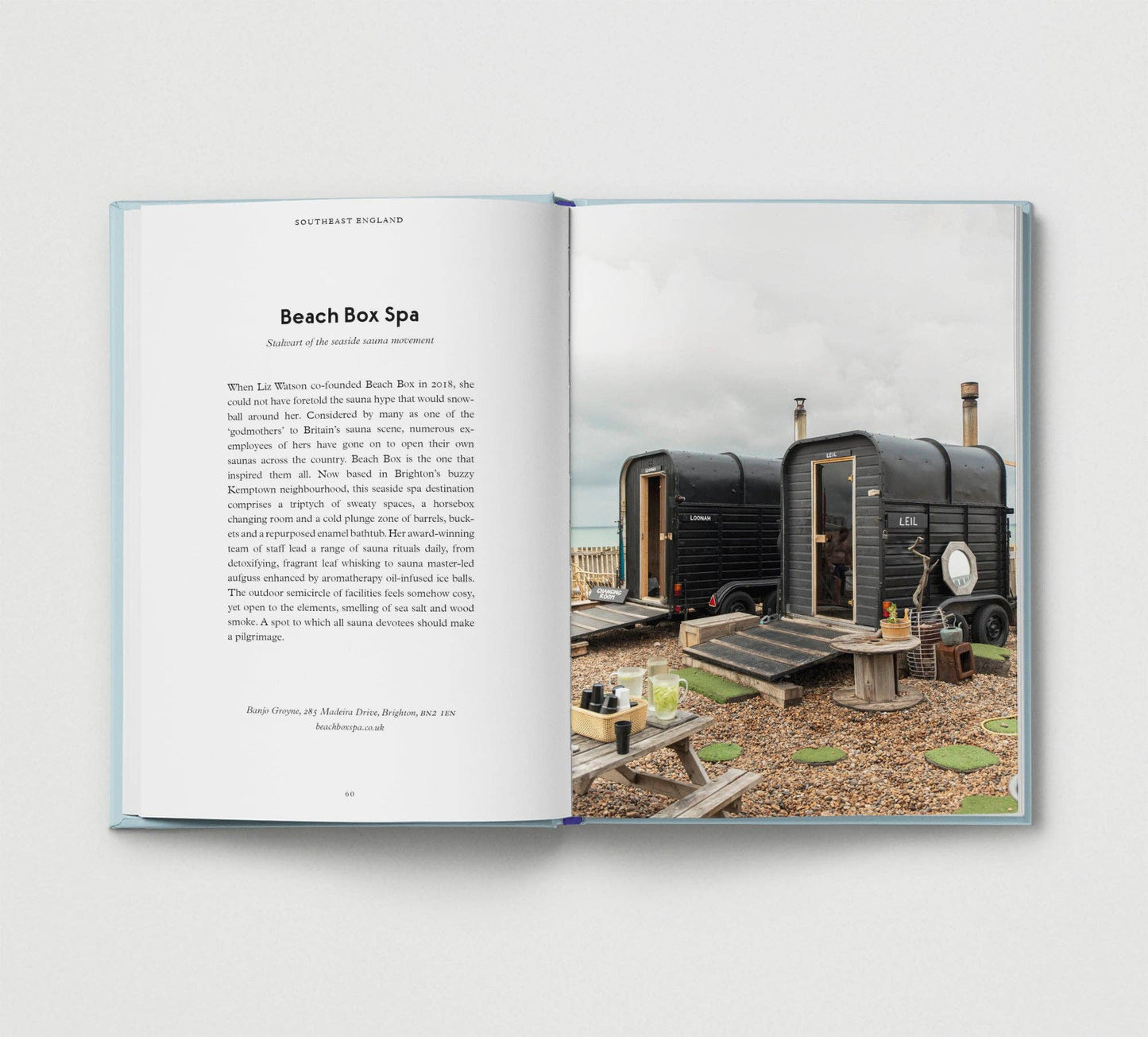 Open book showing a photograph of a beach box spa with text on a white background
