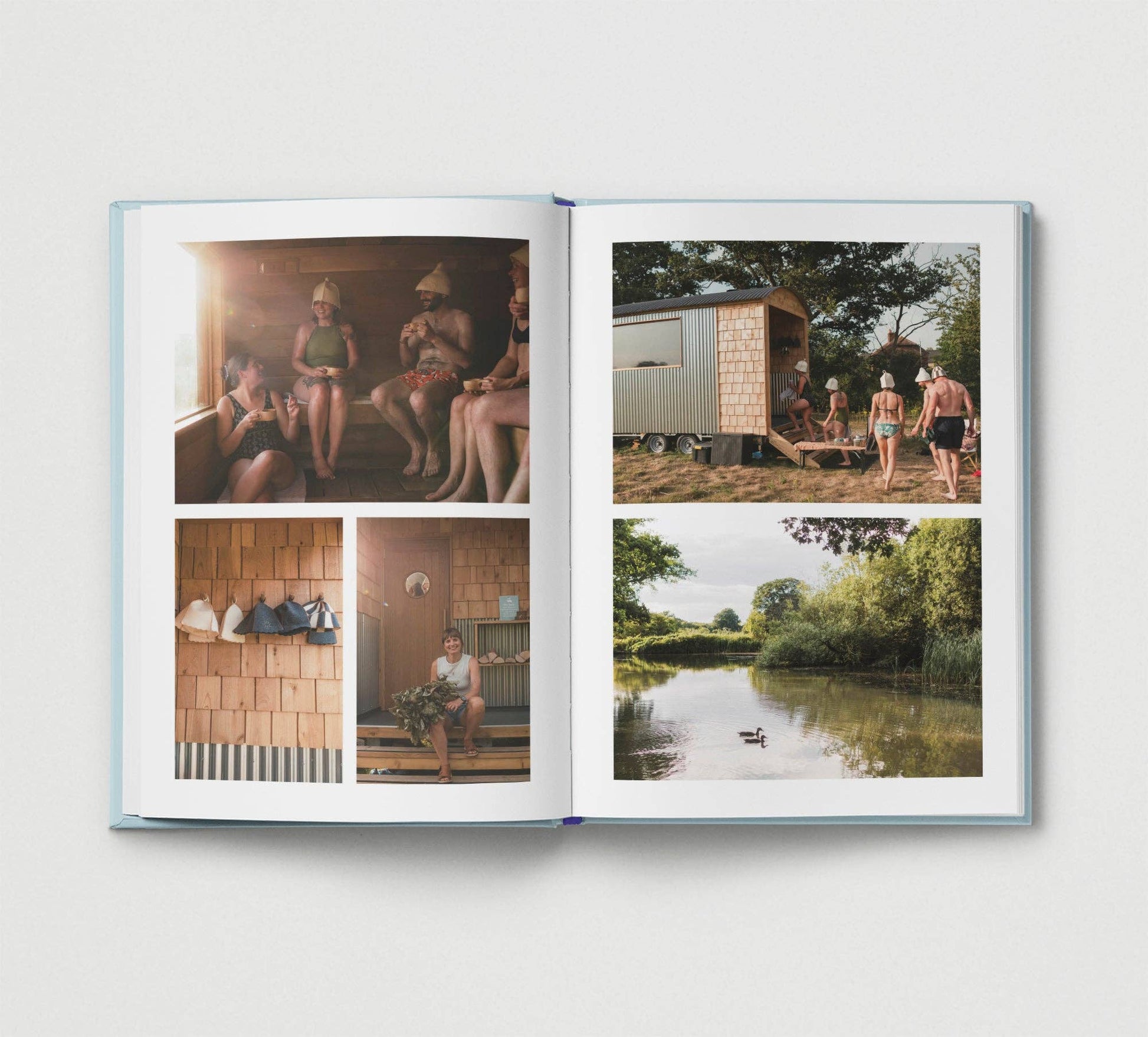 Open book showing photos of people around a sauna and by a lake.