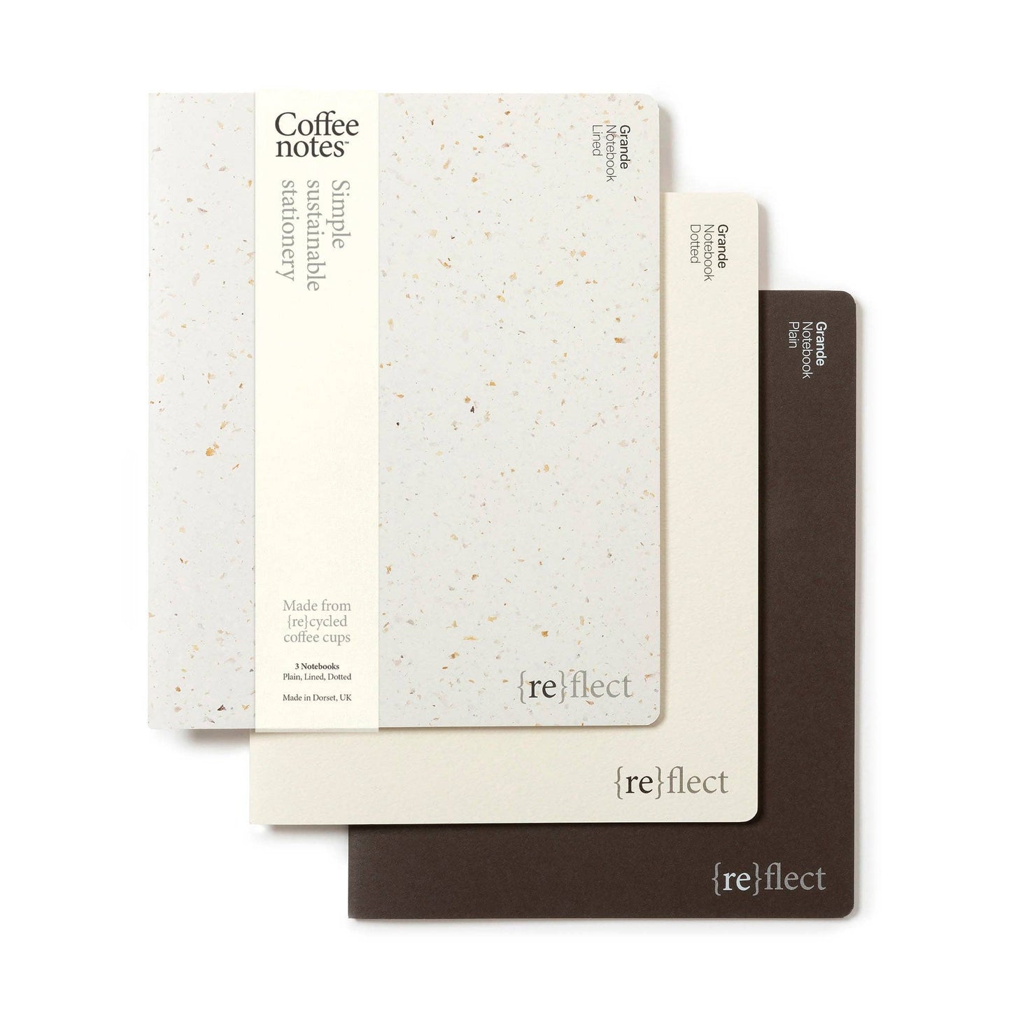 Three notebooks with different covers on a white background