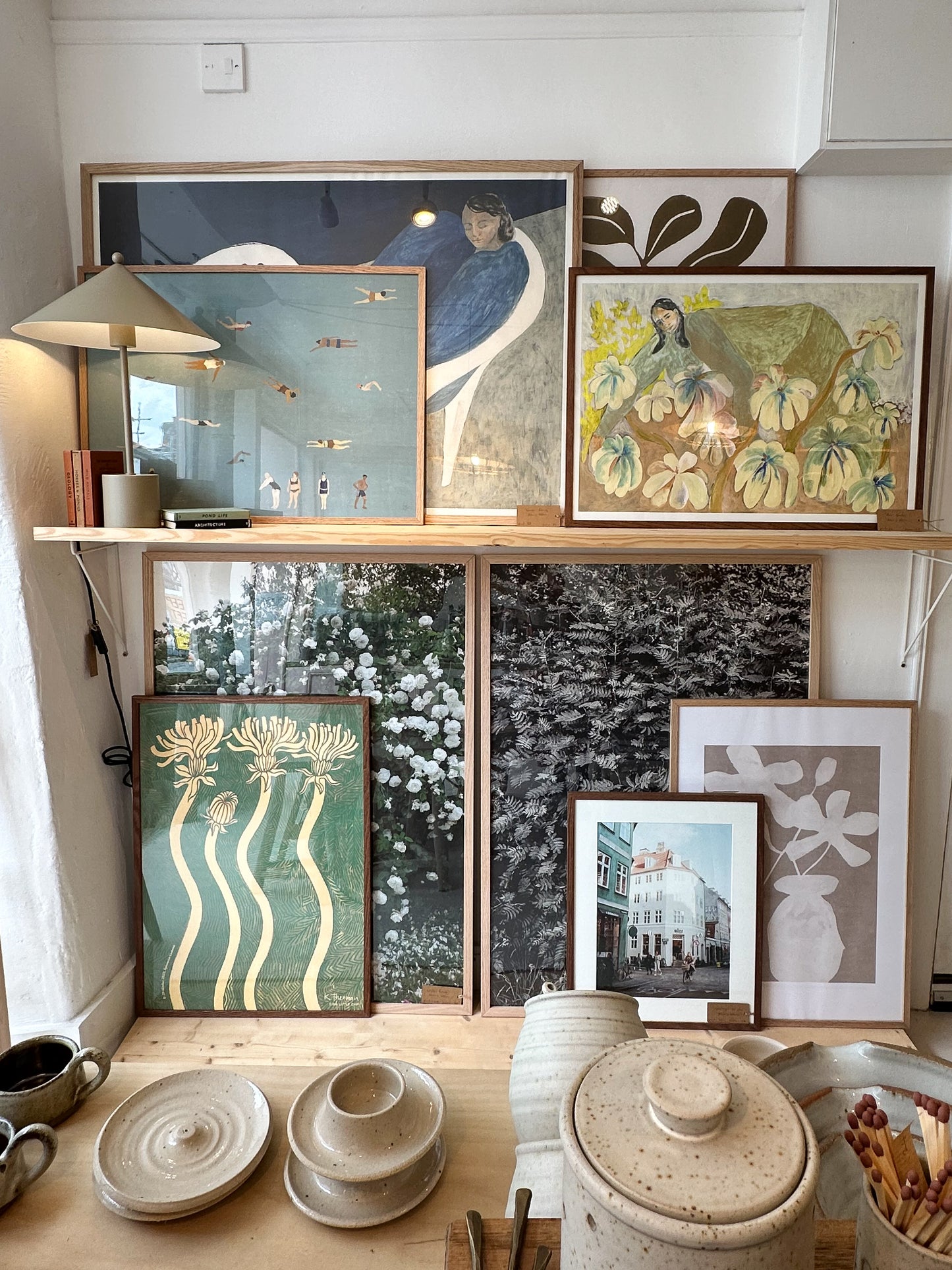 Assortment of framed posters and prints.