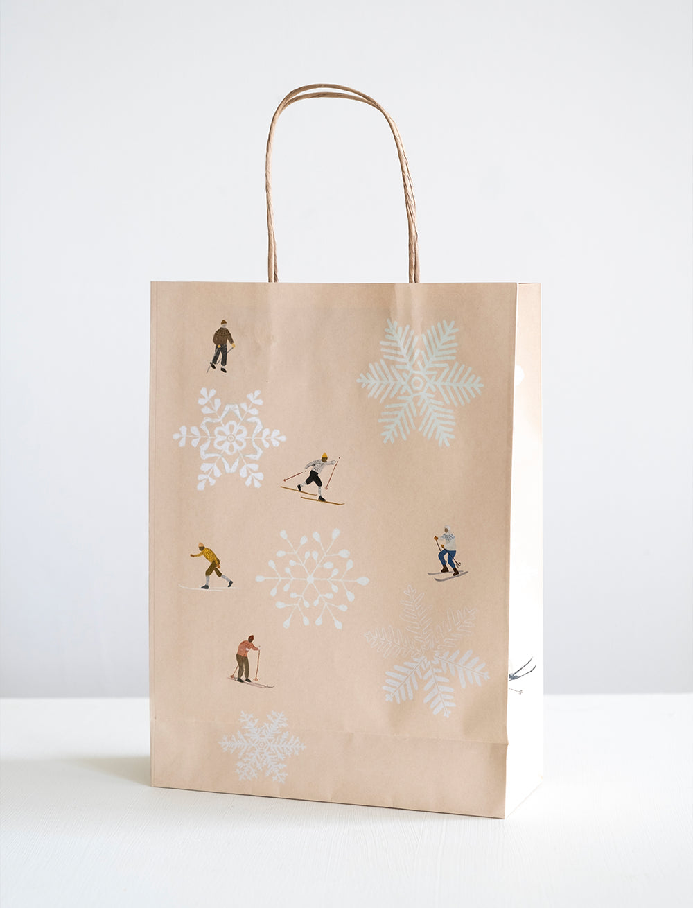  Gift bag with winter-themed illustrations on a white background.