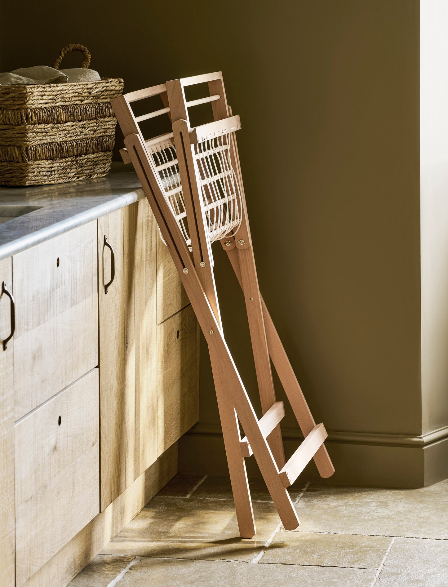 Garden Trading Chalford Airer, made from raw Beech wood, displayed folded in a neutral kitchen setting. 