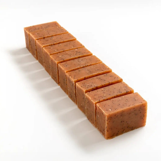 Row of gardeners' soap brick cut into smaller pieces on a white background