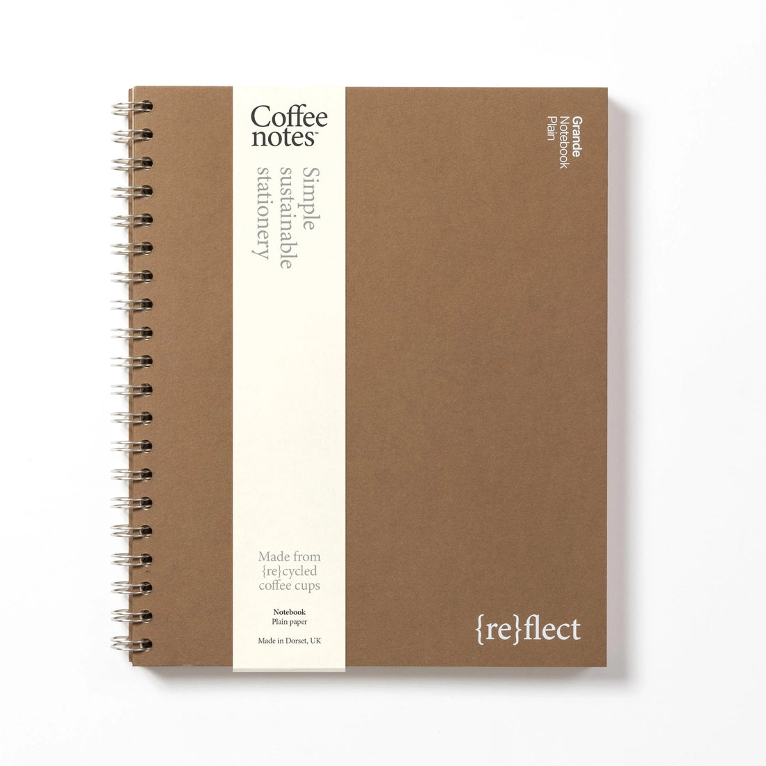 Sustainable notebook made from recycled coffee cups with visible branding on a white background.