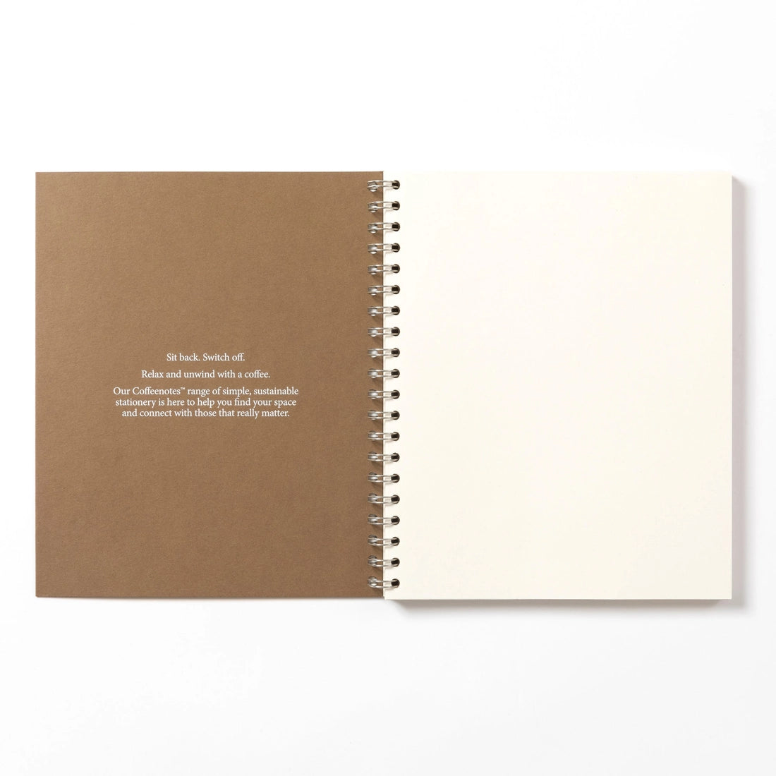 Open notebook with brown cover and white pages on a white background