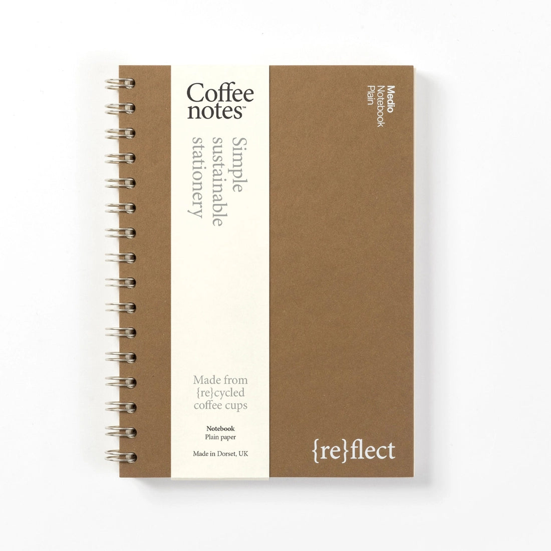 Sustainable notebook made from recycled coffee cups with visible branding on a white background.