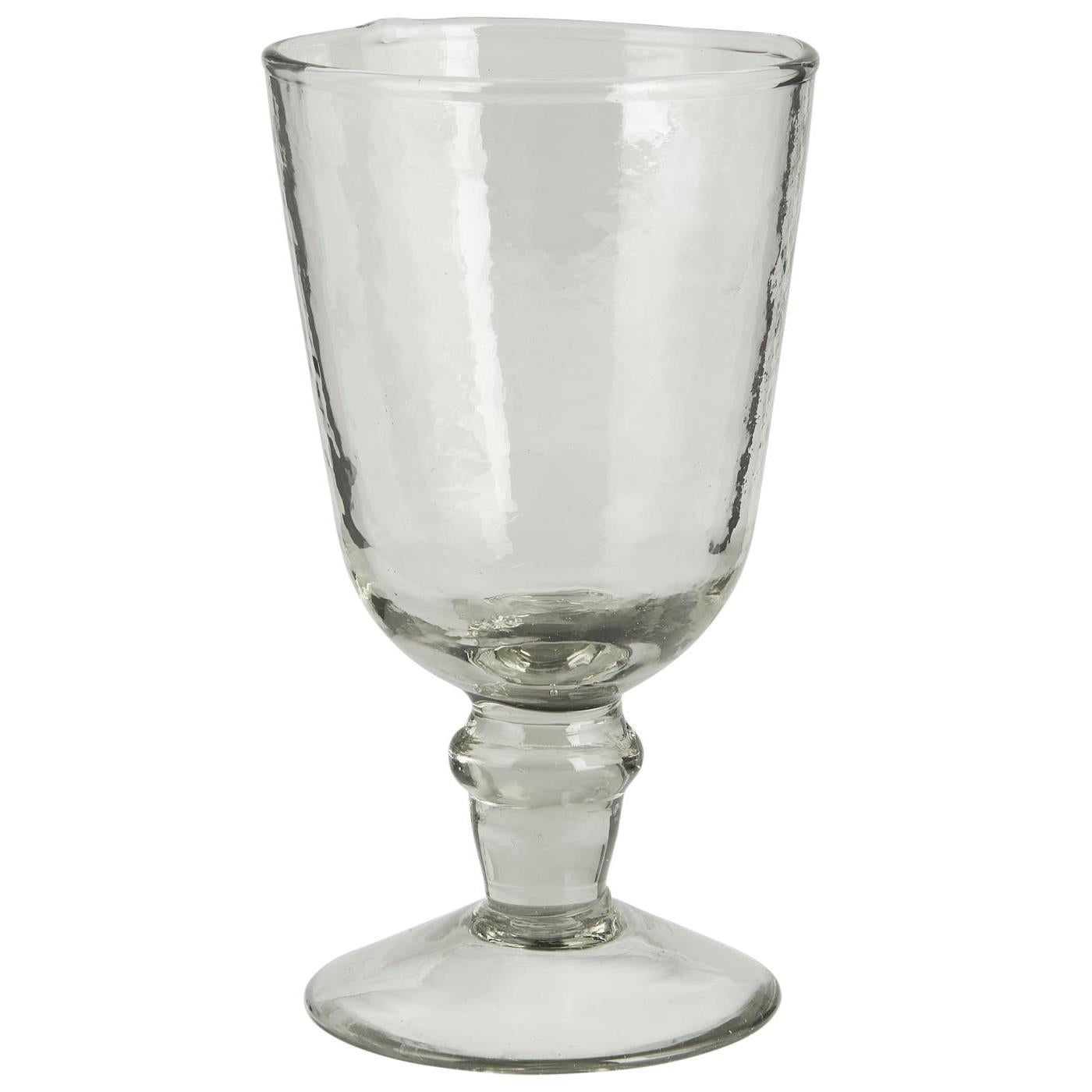 Clear glass goblet on a white background
