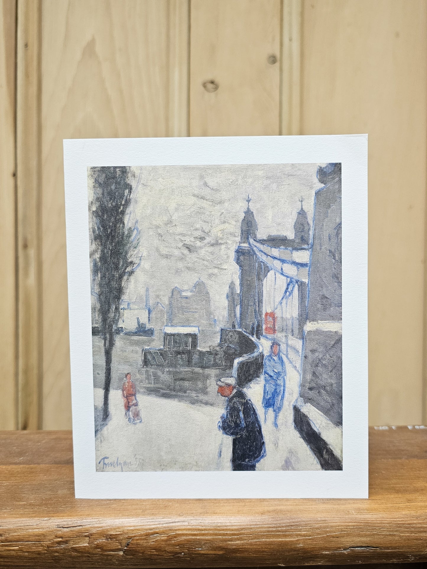 Greeting card reproducing Julian Trevelyan's painting of Hammersmith Bridge in winter, showing figures on an embankment with the bridge and a grey misty Thames beyond