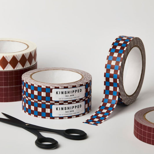 Kinshipped compostable paper tape with brown, blue and cream check pattern for eco-friendly gift wrapping and packaging
