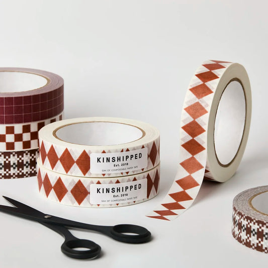 Kinshipped compostable paper tape with burgundy russet diamond pattern for eco-friendly gift wrapping and packaging