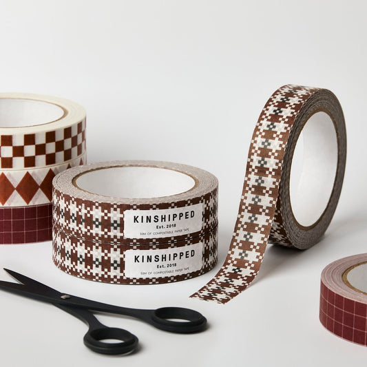Kinshipped compostable paper tape with brown umber tile pattern for eco-friendly gift wrapping and packaging