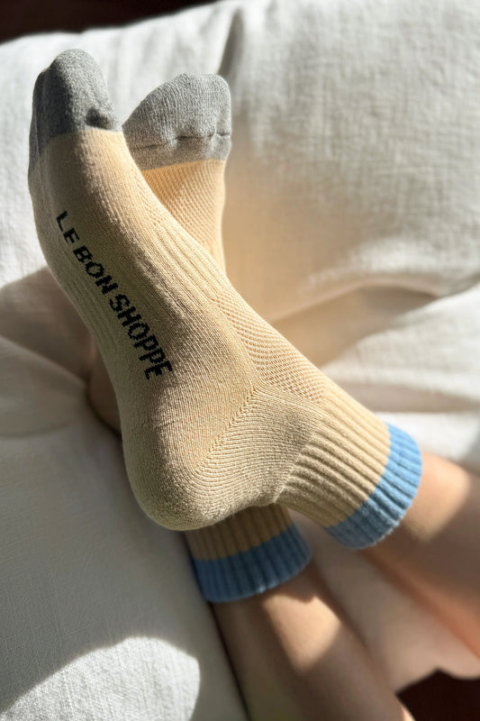 Le Bon Shoppe Girlfriend Socks in Yellow/Blue, bright yellow with blue stripe, pegged on a line