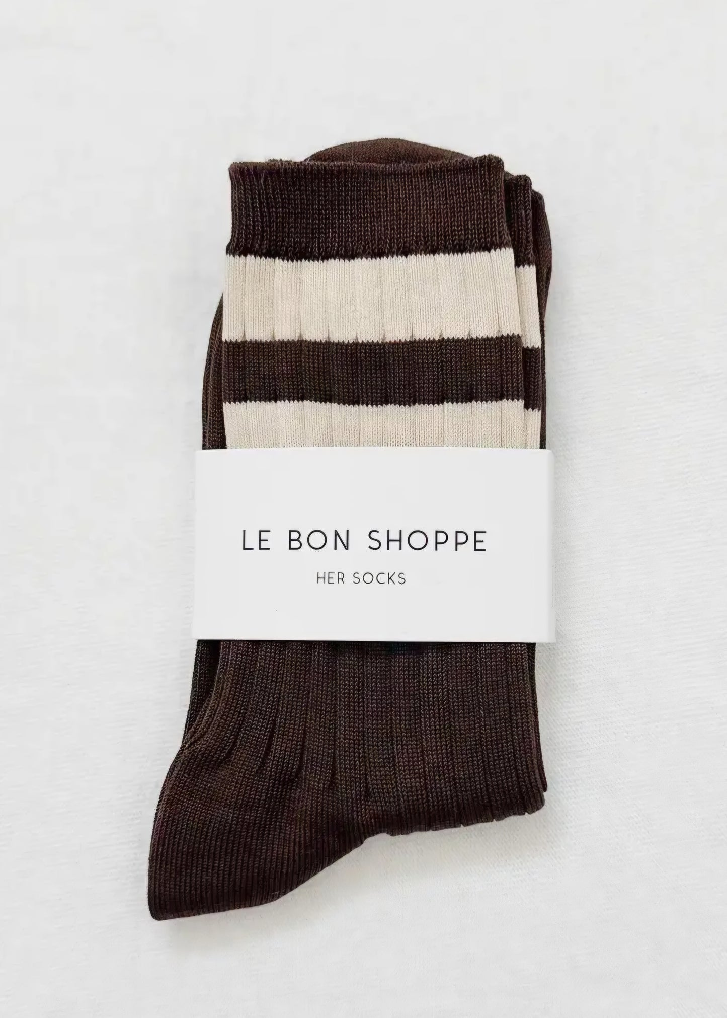 Pair of brown and white striped socks with 'Le Bon Shoppe' label on a light grey background.