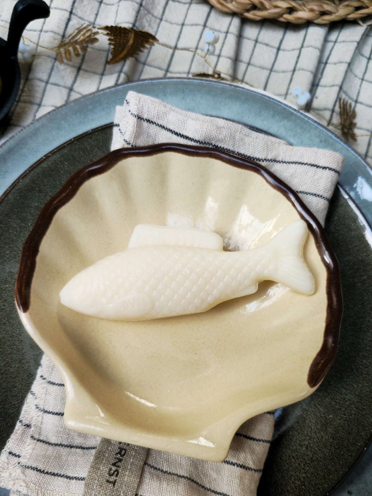 Fish soap in a shell bowl.