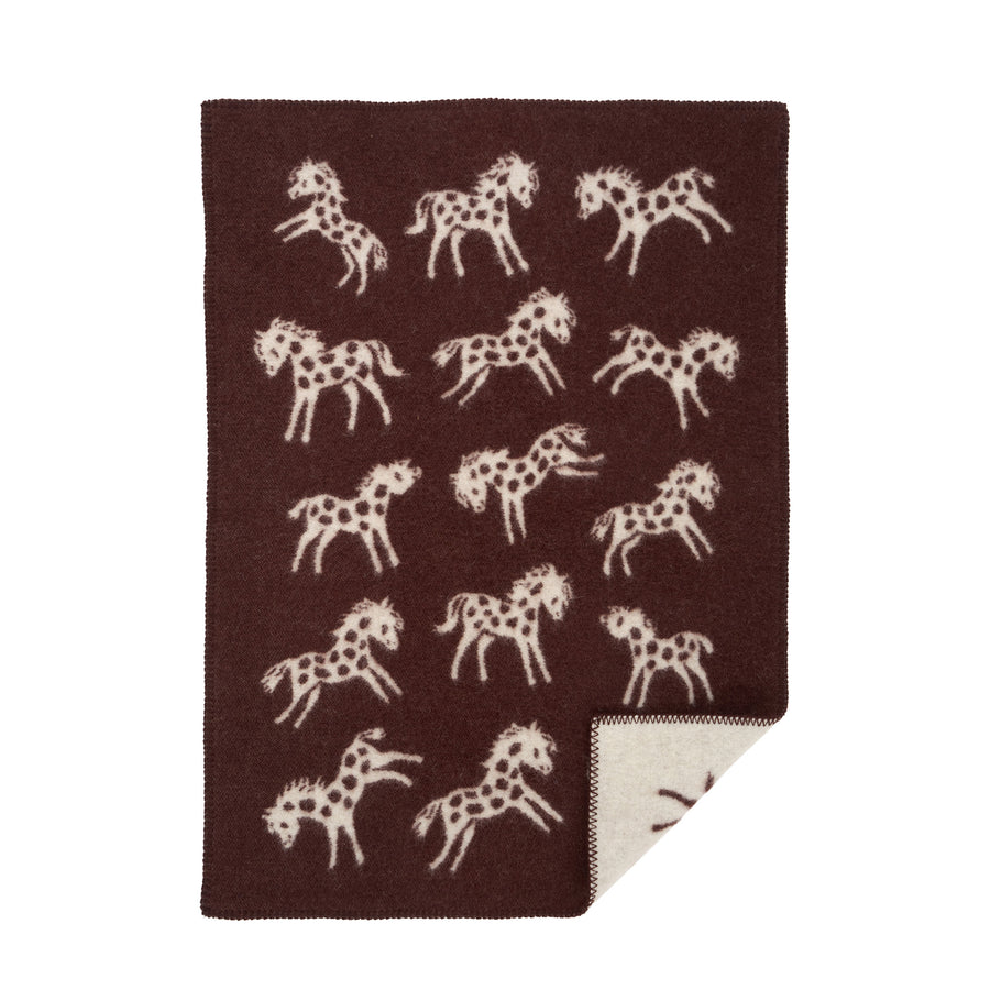 Brown blanket with white horse pattern on a white background