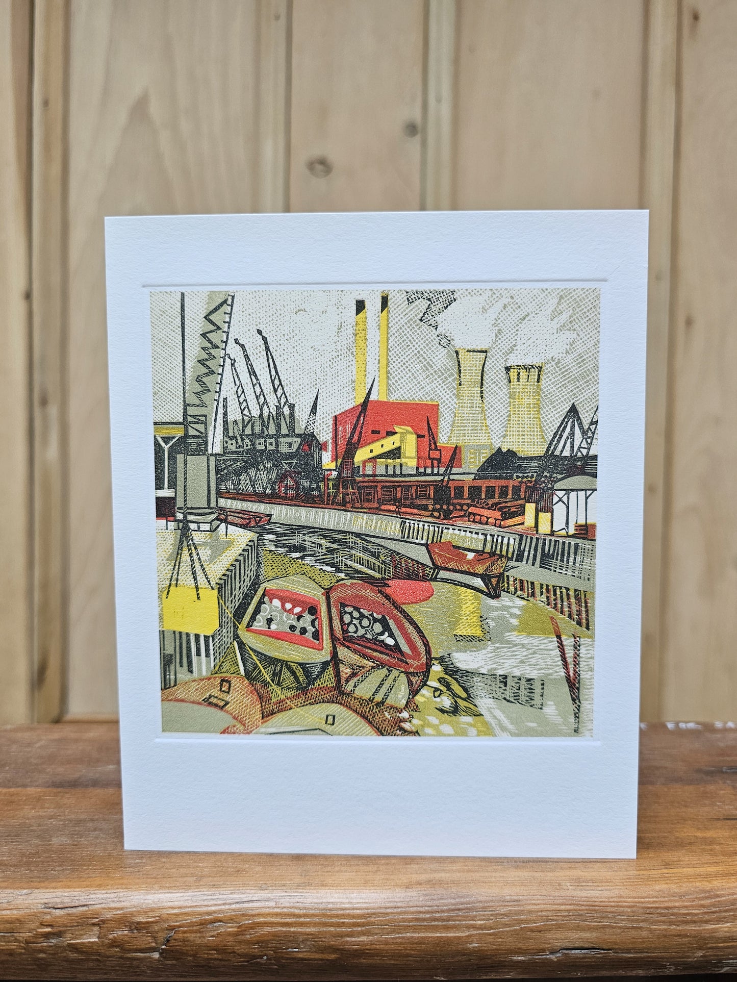 Greeting card reproducing Rupert Shephard's linocut print of the River Lea, showing an industrial riverside scene with cranes, cooling towers, barges and factory buildings