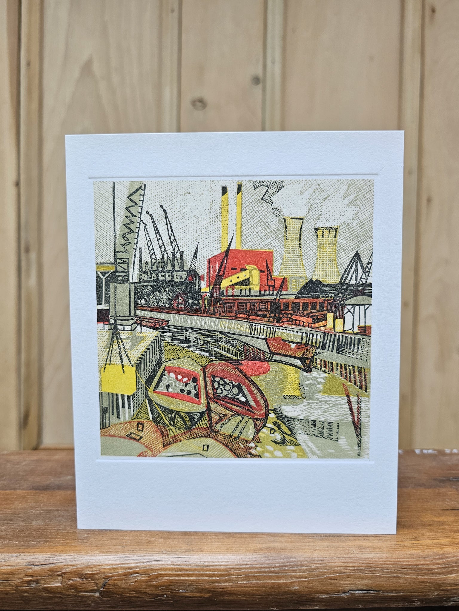 Greeting card reproducing Rupert Shephard's linocut print of the River Lea, showing an industrial riverside scene with cranes, cooling towers, barges and factory buildings