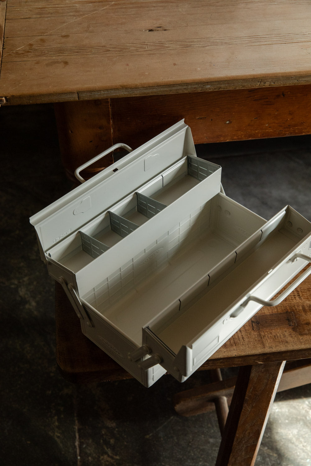 Open Toyo cantilever toolbox showing its fold-out tray compartments