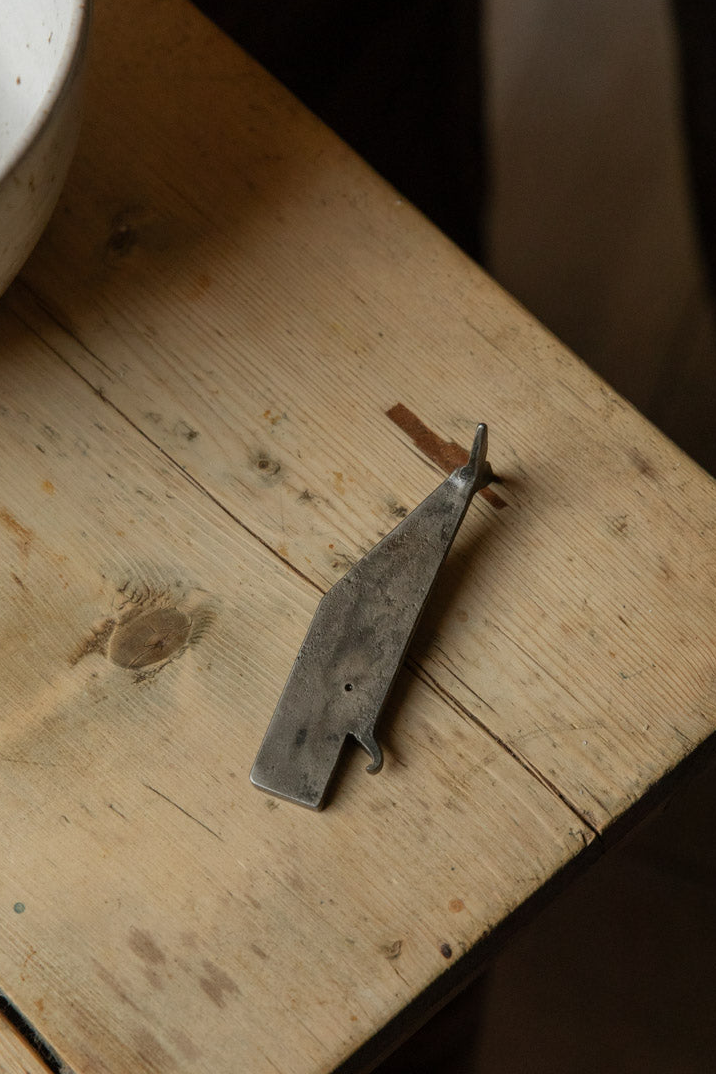Hand-forged iron whale bottle opener by Angus Wood