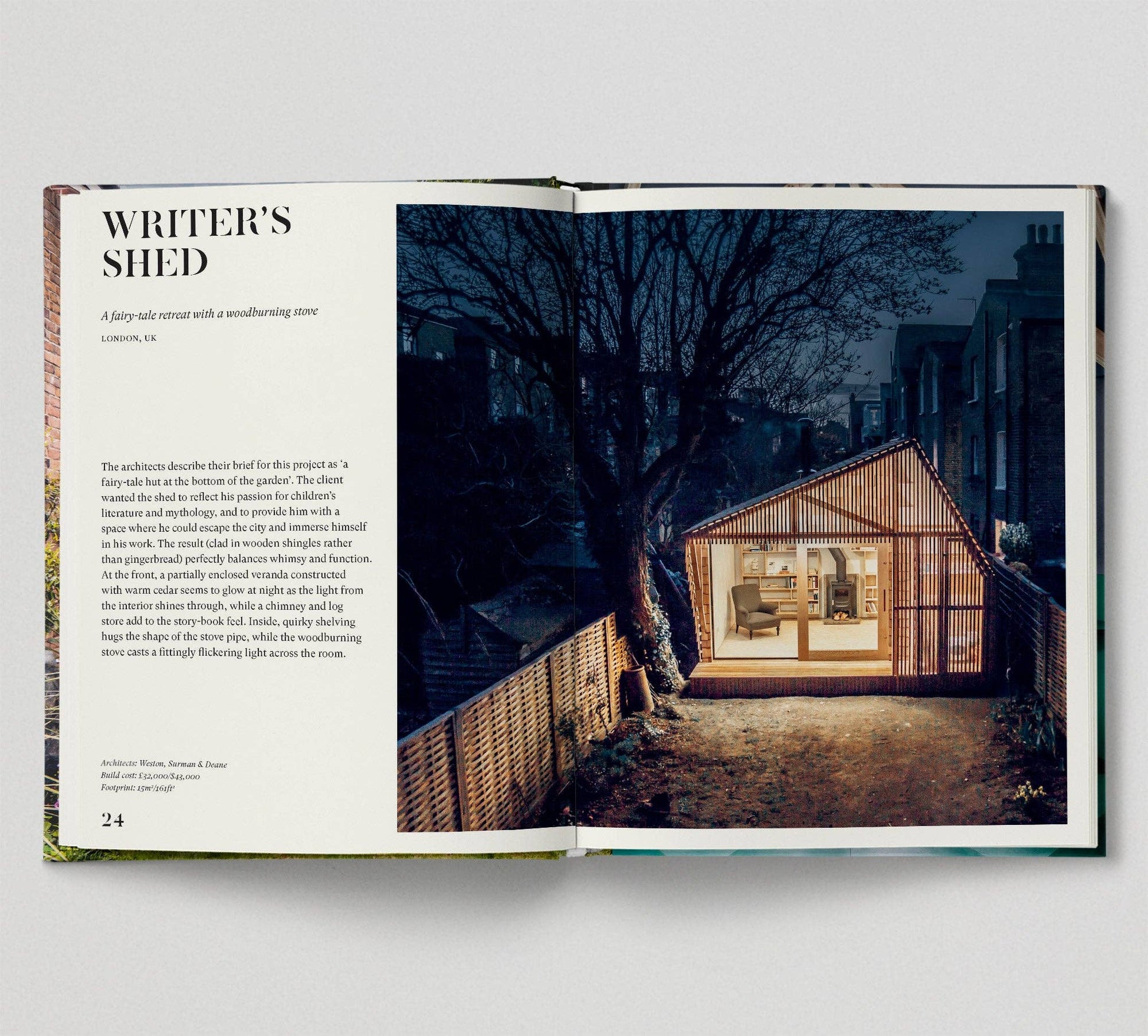 Open book showing a photograph of a small building at night with text on the left page.