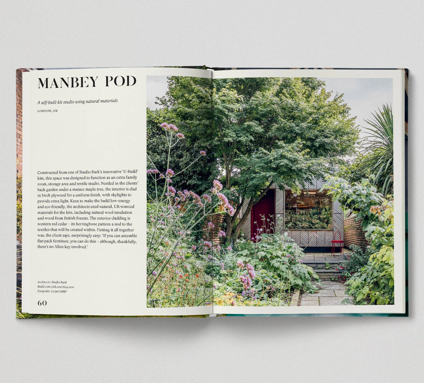 Open book showing a photograph of a small building in a garden with text alongside.