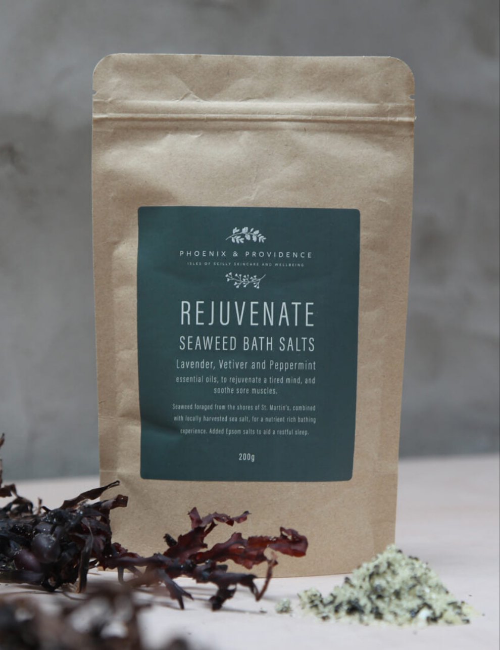 Rejuvenate Seaweed Bath Salts pouch with dried seaweed and loose salts at its base