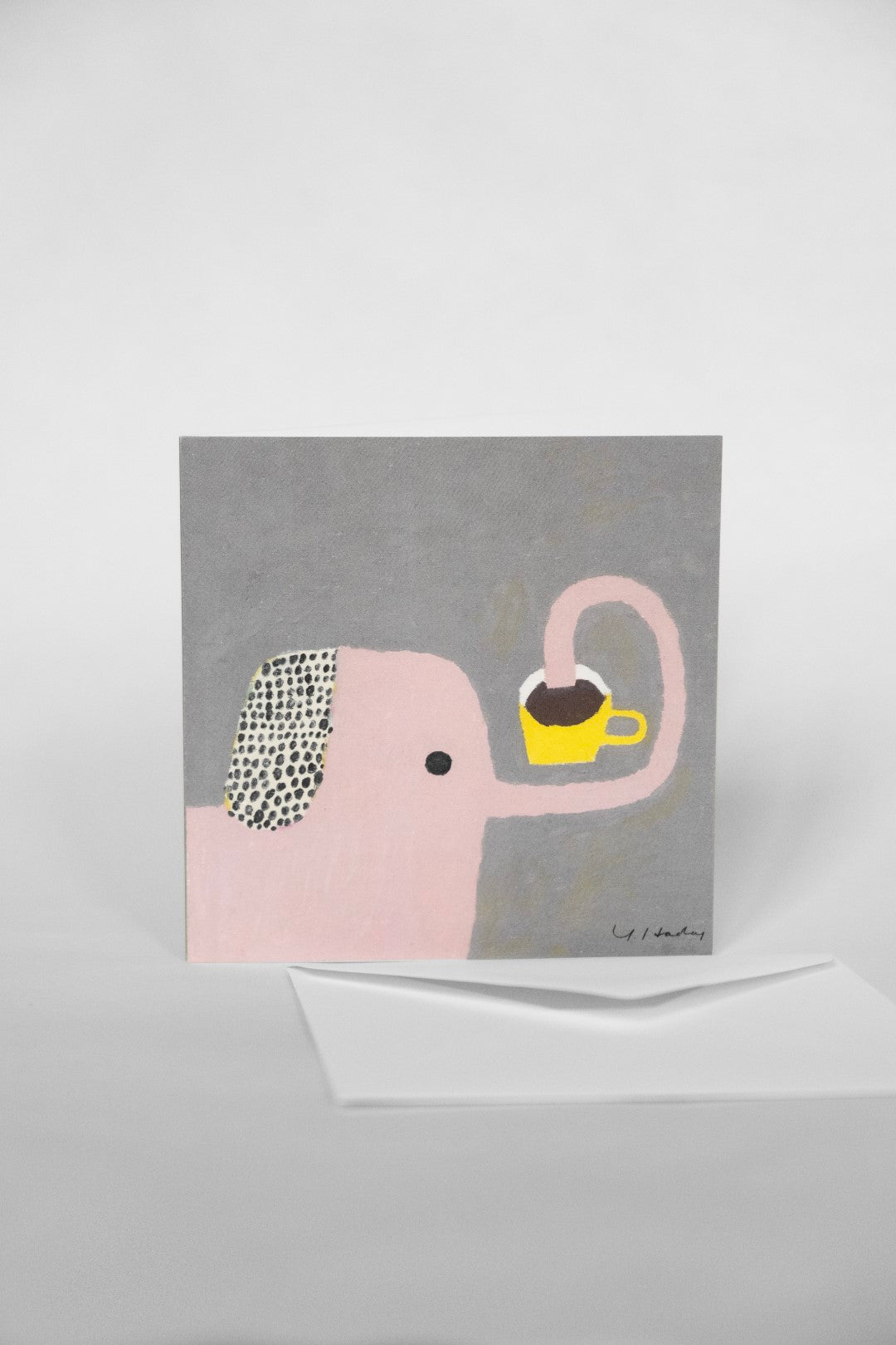 Greeting card with a cartoon drawing of an elephant on it against a white background.