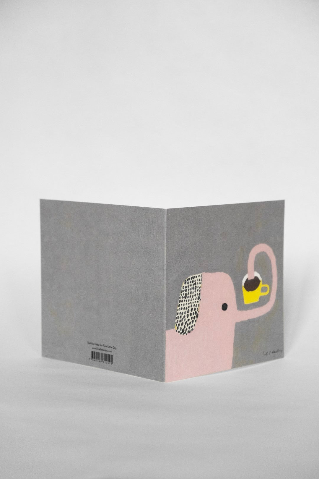 Greeting card with a cartoon drawing of an elephant on it against a white background.