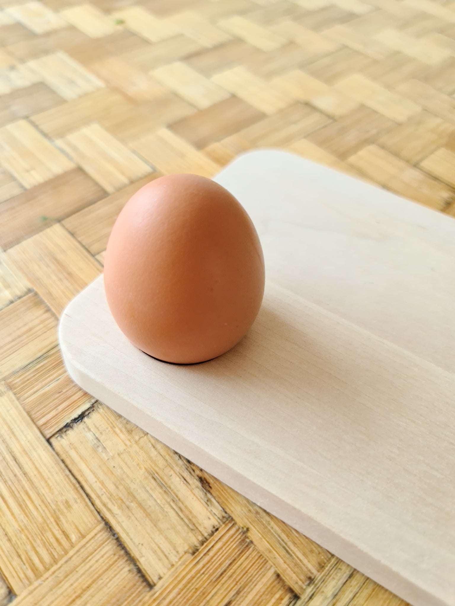 Birch sandwich platter with an egg resting in its hole.