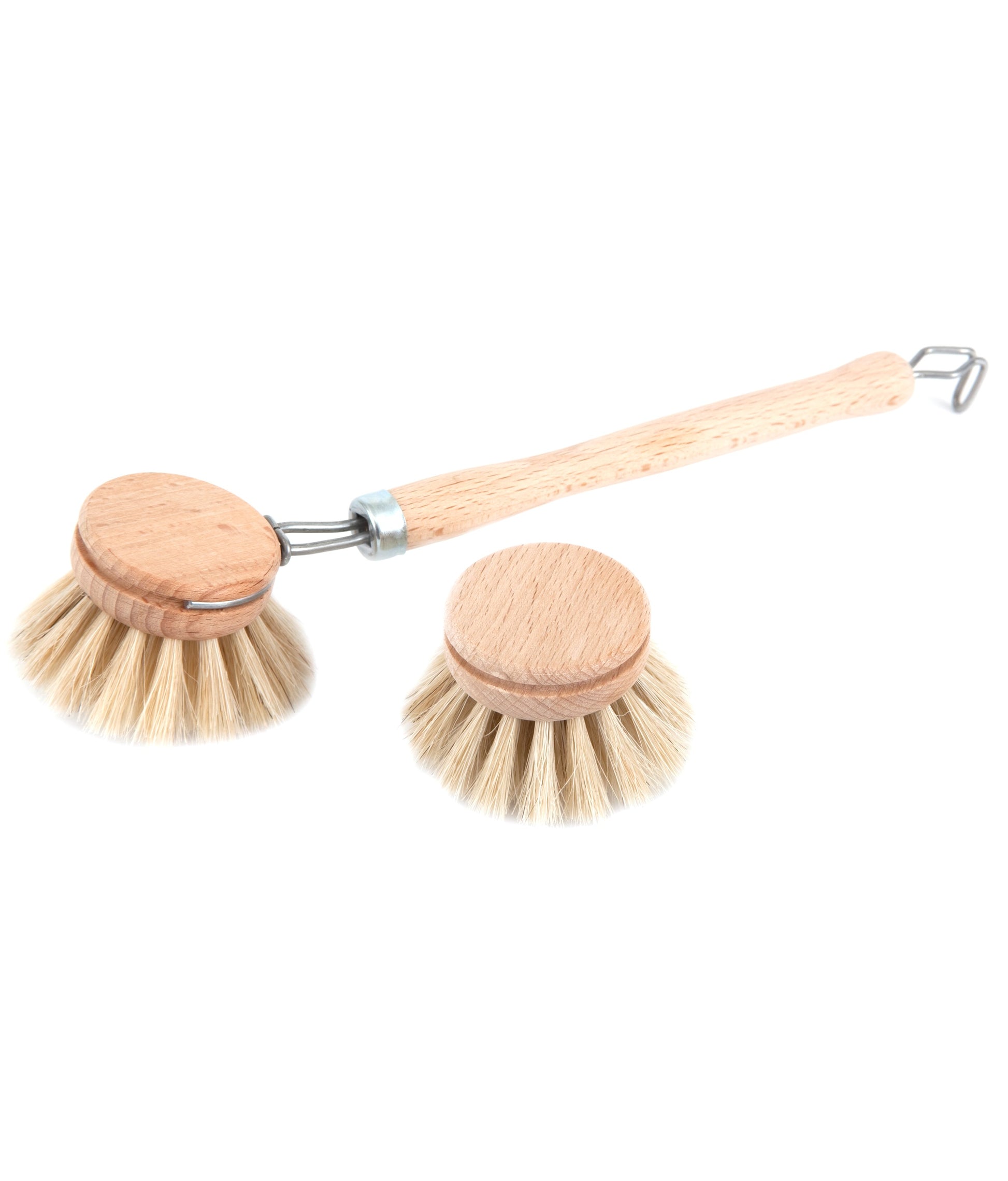 Wooden dish brush and dish brush head against a white background.