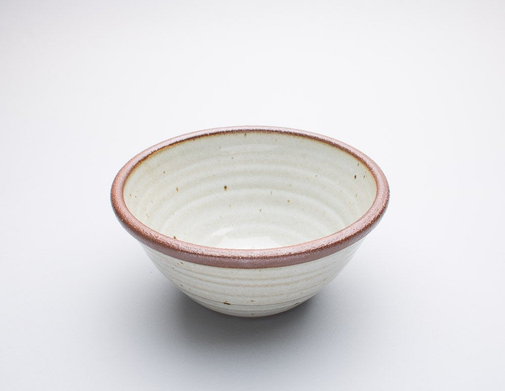 Leach Pottery handthrown bowl on a white background.