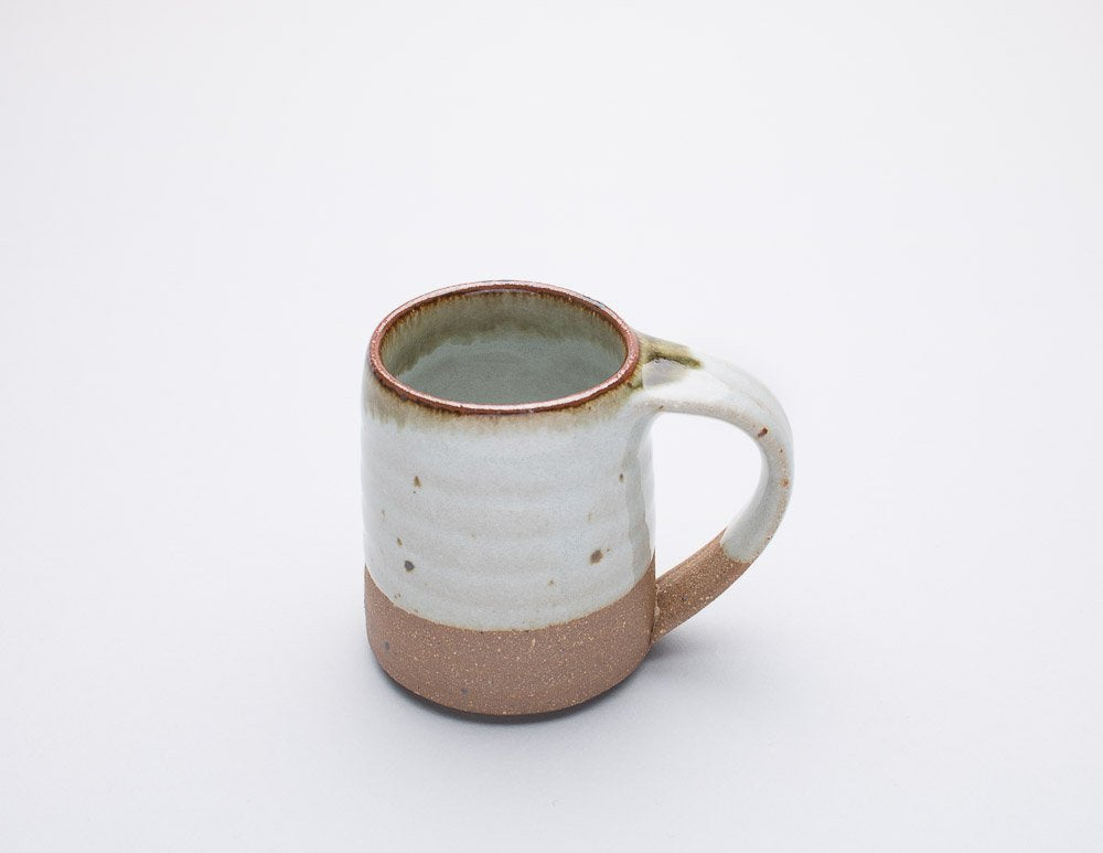 A  Leach Pottery dolomite espresso mug displayed against a white background.