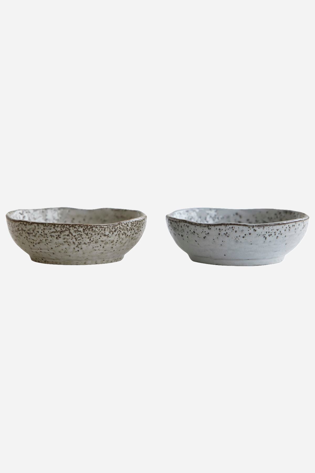 Stock image of two small rustic bowls against a white background.